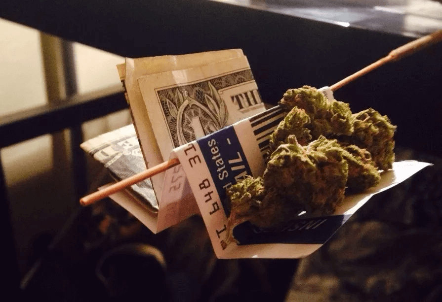 A dollar bill with gram of weed.